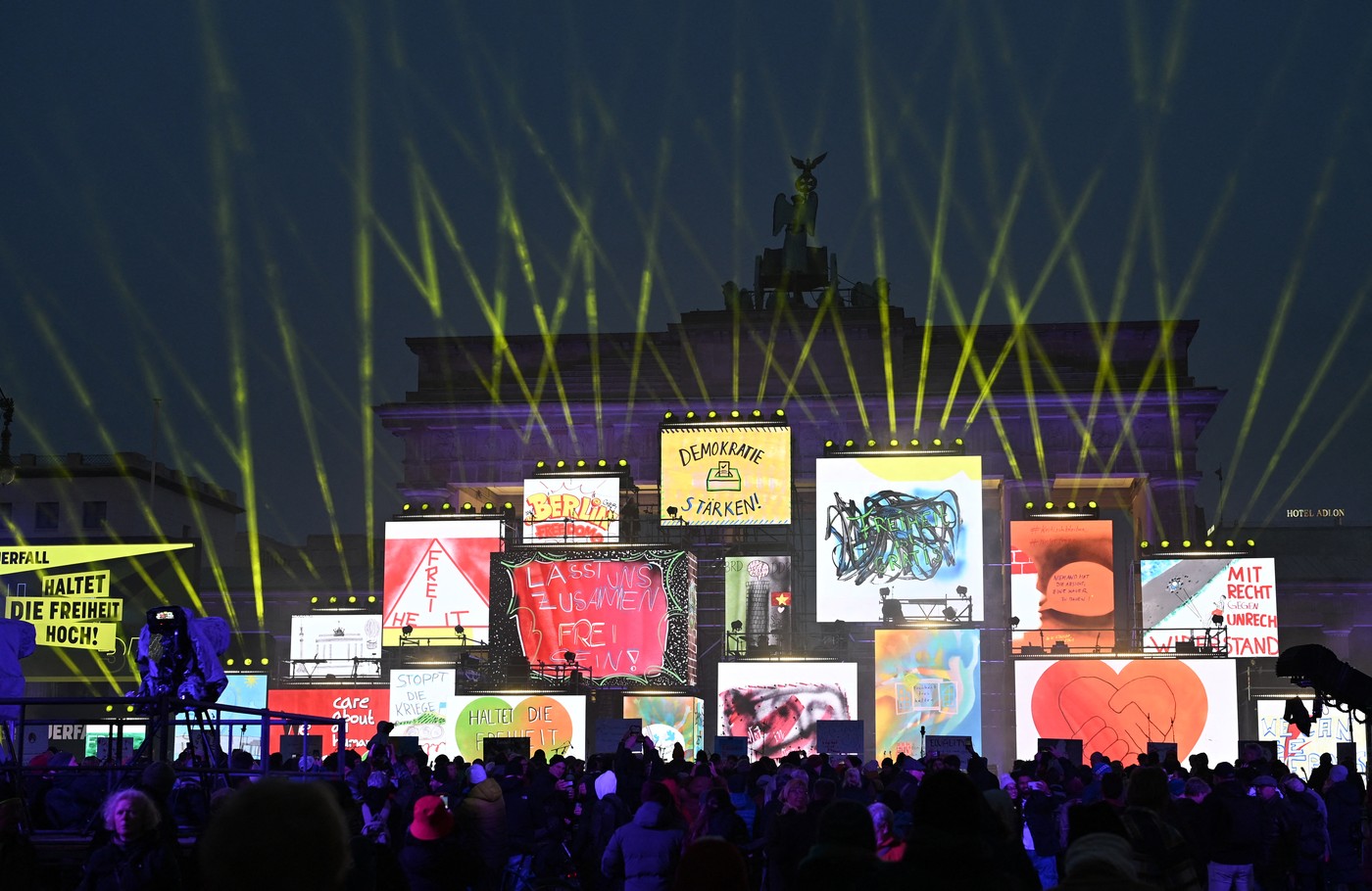 The Brandenburg gate is illuminated during celebrations marking the 35th anniversary of the fall of the Berlin Wall in Berlin on November 9, 2024. Germany on Saturday celebrates 35 years since the fall of the Berlin Wall ushered in the end of communism and national reunification.,Image: 932336983, License: Rights-managed, Restrictions: , Model Release: no, Credit line: RALF HIRSCHBERGER / AFP / Profimedia