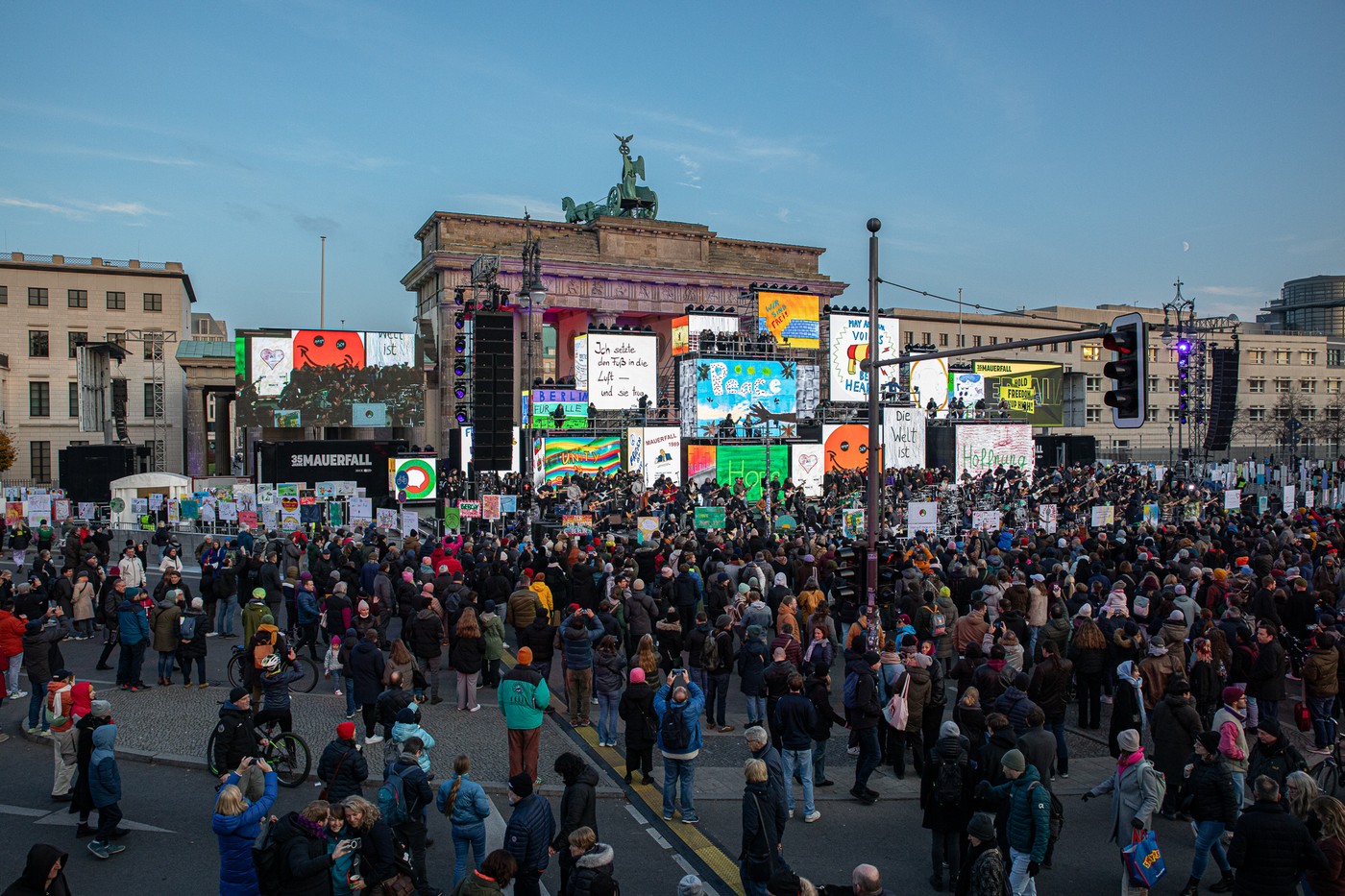 November 9, 2024, Berlin, Germany: Today, on November 9, 2024, Berlin commemorates the 35th anniversary of the Berlin Wall's fall, a milestone that ended Germany's division and marked the peaceful end of East Germany's communist regime. The fall of the Wall on November 9, 1989, symbolized freedom and inspired global movements toward democracy, driven by the courageous actions of East Germans who defied the oppressive Socialist Unity Party (SED) dictatorship. Thousands gathered across iconic Berlin sites, Checkpoint Charlie, Brandenburg Gate, the Reichstag, Potsdamer Platz, and Marshallbruecke, to honor the memory of this historic revolution and reflect on its continued significance. In 1989, mass protests across East Germany demanded basic freedoms like the right to travel, freedom of speech, and freedom of assembly. The spirit of resistance in Leipzig, Berlin, and other cities was fueled by changes in Eastern Europe, including Poland's SolidarnoÅ›Ä‡ movement and Hungary's shift toward democracy, which provided both inspiration and momentum for East German citizens. Banners during that time read ''Democracy â€“ Now or Never,'' ''Free Press for Free People,'' and ''Freedom is Indivisible.'' The slogans, resonant then, echo still in today's world, where democratic values face mounting challenges. This year's theme, ''Hold Freedom High!'' reflects a renewed call for vigilance and unity in defending those hard-won freedoms. The day's events include an extensive open-air installation marking the former path of the Wall, showcasing replicas of banners from the 1989 protests alongside new creations made in workshops by Berliners of all ages. The installation stretches from Invalidenstrasse through Checkpoint Charlie to Axel-Springer-Strasse, symbolically merging historical demands for freedom with the hopes and challenges of today. Attendees are invited to reflect on the sacrifices of those who lo,Image: 932493688, License: Rights-managed, Restrictions: , Model Release: no, Credit line: Michael Kuenne / Zuma Press / Profimedia