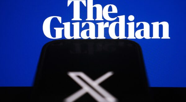 ANKARA, TURKIYE - NOVEMBER 13: The logo of 'X' is seen on a mobile screen in front 'The Guardian' logo in Ankara, Turkiye on November 13, 2024. Muhammed Selim Korkutata / Anadolu,Image: 933916997, License: Rights-managed, Restrictions: , Model Release: no, Credit line: Muhammed Selim Korkutata / AFP / Profimedia