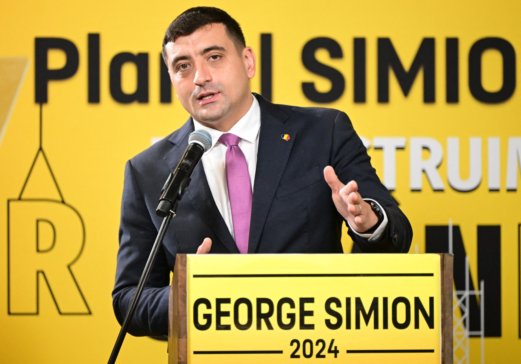 Presidential candidate and leader of the far-right Alliance for the Unity of Romanians AUR party, George Simion, addresses a press conference at his party's headquarters in Bucharest on November 20, 2024, ahead of the country's presidential election.   A declared fan of US president elect Donald Trump, Simion, 38, hopes to get a boost from Trump’s win. After surprisingly entering the Romanian Parliament four years ago, with almost 10% of the votes cast in its favour, AUR is expected to double that percentage in the parliamentary elections organised a week after the first round of the presidential ballot. According to analysts, the percentage could even be higher if its leader George Simion manages to get in the second round of the presidential elections. Current polls place him at 19,1%, right behind front runner Marcel Ciolacu, credited with 25,3%.,Image: 937474601, License: Rights-managed, Restrictions: , Model Release: no, Credit line: Daniel MIHAILESCU / AFP / Profimedia