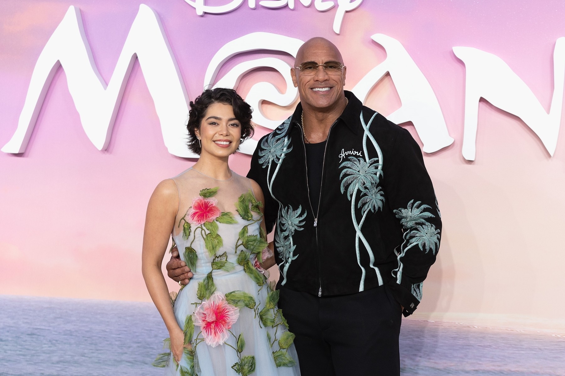 London, UNITED KINGDOM  - Auli’l Cravalho and Dwayne Johnson attend the UK Premiere of Moana 2 presented by WALT DISNEY Animation Studios at Cineworld in Leicester Square, London, England on 24th November 2024. CREDIT: SUMO

BACKGRID UK 24 NOVEMBER 2024,Image: 938591962, License: Rights-managed, Restrictions: , Model Release: no, Pictured: Auli’l Cravalho, Dwayne Johnson, Credit line: SUMO / BACKGRID / Backgrid UK / Profimedia