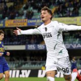 Empoli's Sebastiano Esposito celebrates after scoring his side's second goal during the Italian Serie A soccer match between Hellas Verona and Empoli at the Marcantonio Bentegodi Stadium, in Verona, Italy, Sunday Dec. 8, 2024. (Paola Garbuio/LaPresse via AP)