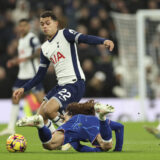 Tottenham's Brennan Johnson challenges for the ball with Chelsea's Marc Cucurella during the English Premier League soccer match between Tottenham Chelsea, at the Hotspur stadium in London, Sunday, Dec.8, 2024. (AP Photo/Ian Walton)