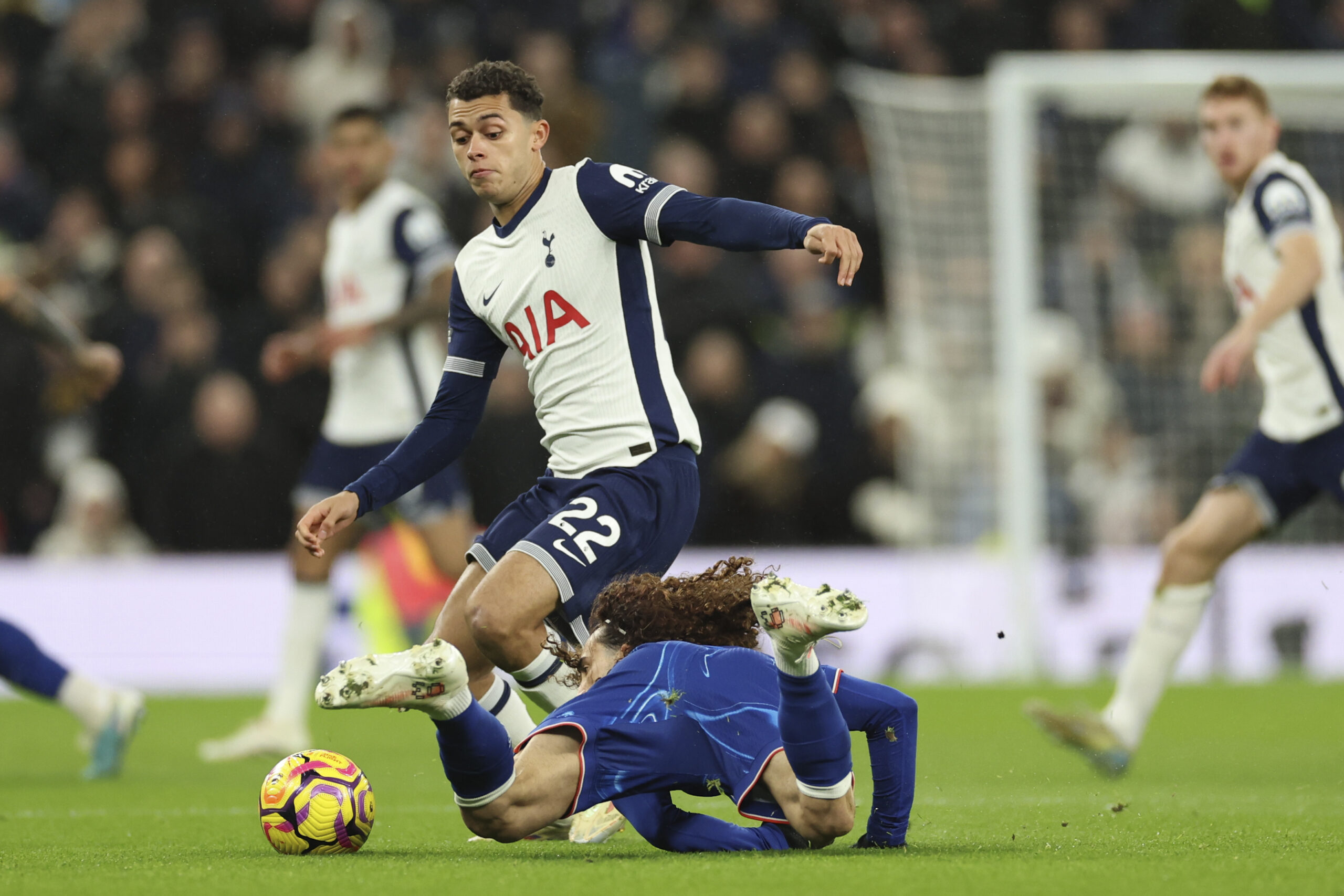 Tottenham's Brennan Johnson challenges for the ball with Chelsea's Marc Cucurella during the English Premier League soccer match between Tottenham Chelsea, at the Hotspur stadium in London, Sunday, Dec.8, 2024. (AP Photo/Ian Walton)