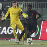 Chelsea's Tyrique George, right, fights for the ball with Astana's Marin Tomasov during the Europa Conference League opening phase soccer match between Astana and Chelsea at the Almaty Ortalyk stadium in Almaty, Kazakhstan, Thursday, Dec. 12, 2024. (AP Photo)