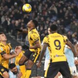 Inter Milan's Denzel Dumfries, centre, controls the ball during the Italian Serie A soccer match between Lazio and Inter at Rome's Olympic Stadium, Rome, Italy, Monday, Dec. 16, 2024. (AP Photo/Gregorio Borgia)