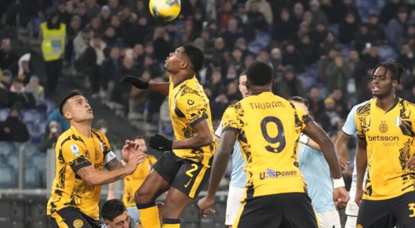 Inter Milan's Denzel Dumfries, centre, controls the ball during the Italian Serie A soccer match between Lazio and Inter at Rome's Olympic Stadium, Rome, Italy, Monday, Dec. 16, 2024. (AP Photo/Gregorio Borgia)