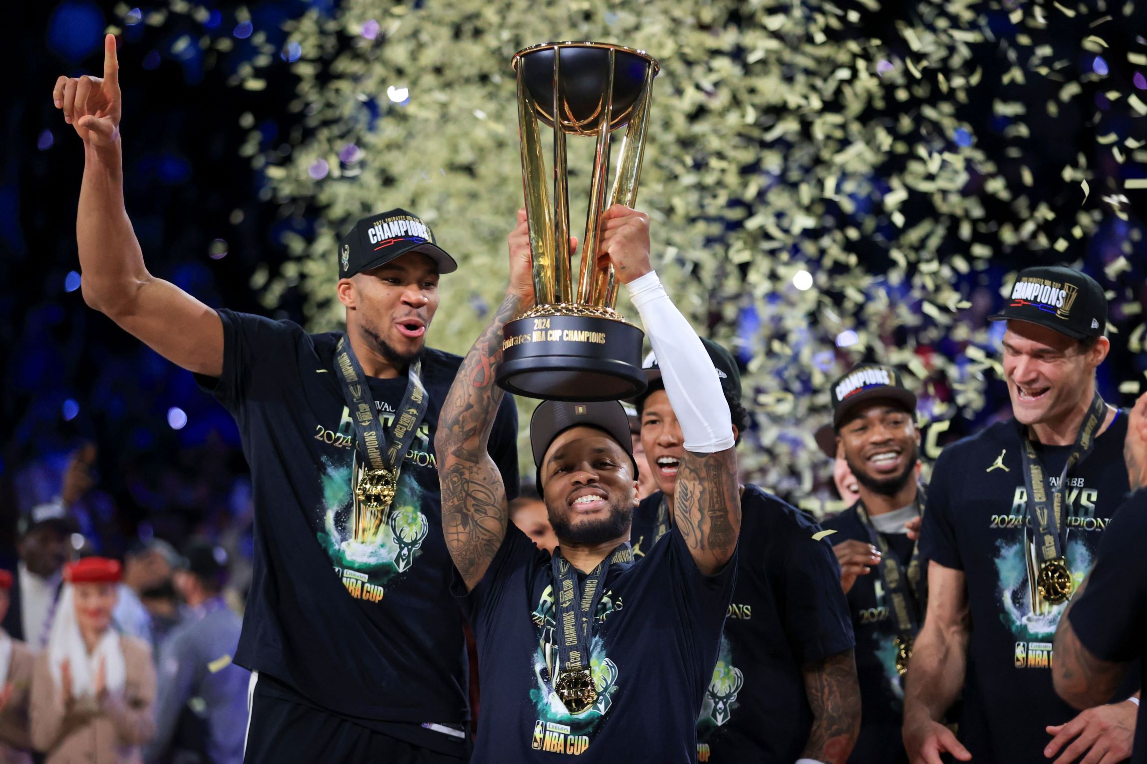 Milwaukee Bucks forward Giannis Antetokounmpo (34) yells while lifting up the NBA Cup after his team's victory in the championship game of the NBA Cup basketball tournament against the Oklahoma City Thunder Tuesday, Dec. 17, 2024, in Las Vegas. (AP Photo/Ian Maule) NBA Cup Bucks Thunder Basketball