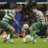 Chelsea's Kiernan Dewsbury-Hall, second from left, and Shamrock Rovers's Markus Poom vie for the ball during the Europa Conference League opening phase soccer match between Chelsea and Shamrock Rovers at Stamford Bridge stadium in London, Thursday, Dec. 19, 2024. (AP Photo/Ian Walton)