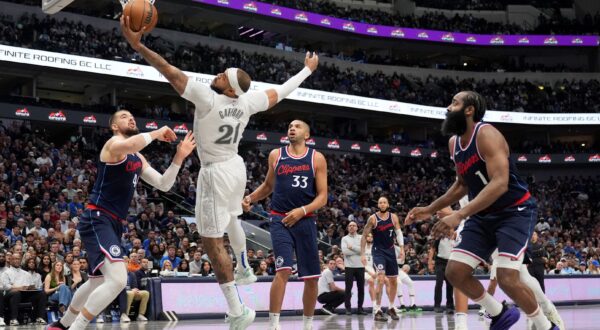 Dallas Mavericks center Daniel Gafford (21) grabs a rebound in front of Los Angeles Clippers' Ivica Zubac, left, Nicolas Batum (33) and James Harden (1) in the second half of an NBA basketball game in Dallas, Thursday, Dec. 19, 2024. (AP Photo/Tony Gutierrez) Clippers Mavericks Basketball