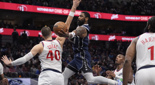 Dallas Mavericks guard Kyrie Irving (11) drives against Los Angeles Clippers center Ivica Zubac (40) during the second half of an NBA basketball game Saturday, Dec. 21, 2024, in Dallas. (AP Photo/LM Otero)