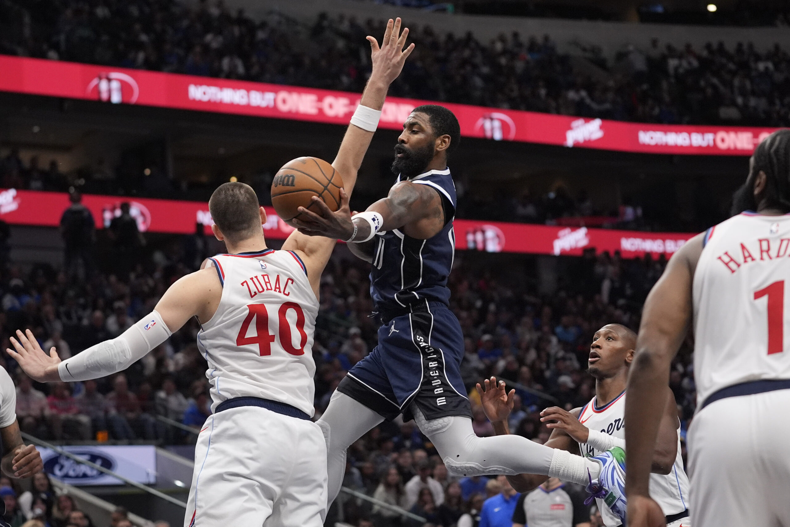 Dallas Mavericks guard Kyrie Irving (11) drives against Los Angeles Clippers center Ivica Zubac (40) during the second half of an NBA basketball game Saturday, Dec. 21, 2024, in Dallas. (AP Photo/LM Otero)