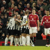 Manchester United's Harry Maguire, center, and Manchester United's Casemiro react after Newcastle's Alexander Isak scoring his side's opening goal during the English Premier League soccer match between Manchester United and Newcastle at the Old Trafford stadium in Manchester, England, Monday, Dec. 30, 2024. (AP Photo/Dave Thompson)