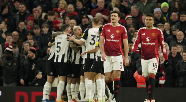 Manchester United's Harry Maguire, center, and Manchester United's Casemiro react after Newcastle's Alexander Isak scoring his side's opening goal during the English Premier League soccer match between Manchester United and Newcastle at the Old Trafford stadium in Manchester, England, Monday, Dec. 30, 2024. (AP Photo/Dave Thompson)