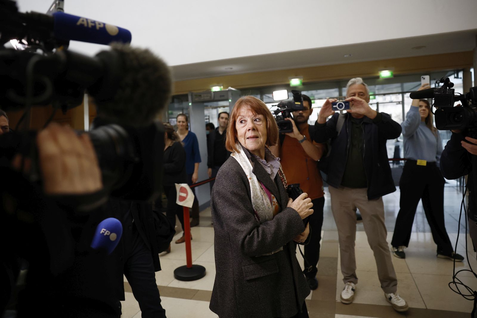 epa11739300 Gisele Pelicot (C) arrives at the criminal court in Avignon, France, 25 November 2024, where her ex-husband stands trial. Dominique Pelicot is accused of drugging and raping his then-wife, Gisele Pelicot. He is also accused of inviting dozens of men to rape her while she was unconscious at their home in Mazan, France, between 2011 and 2020. Fifty other men are facing trial for their alleged involvement. Dominique Pelicot could face a maximum sentence of 20 years in prison if convicted.  EPA/YOAN VALAT