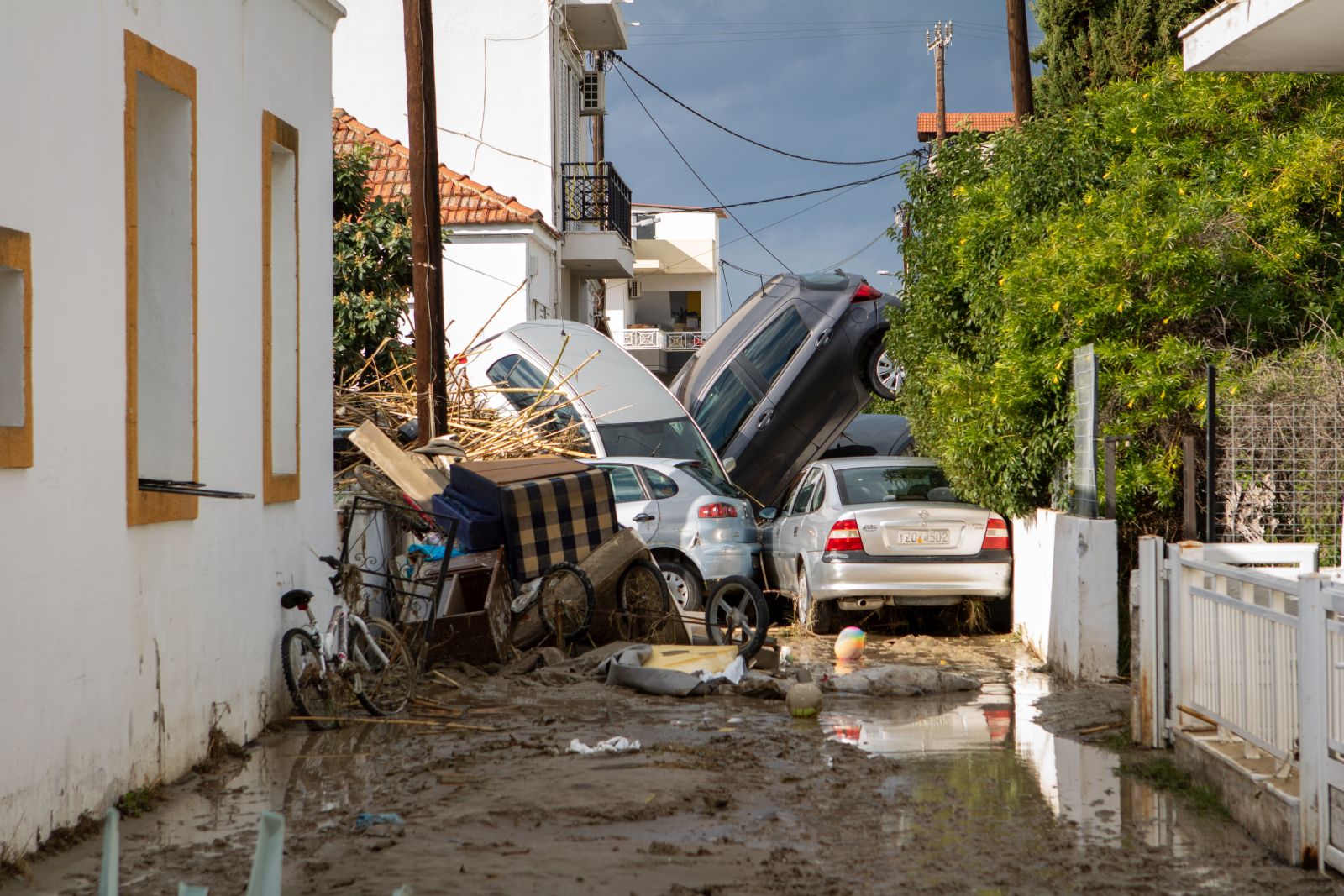 epaselect epa11751465 Cars piled up on a road full of mud following the passage of storm bora in Ialyssos, Rhodes, Greece, 01 December 2024. The island of Rhodes has been in a state of emergency for the last few hours as the bad weather from storm Bora is still ongoing. The road network in the municipal units of Ialyssos and Kallithea has been damaged. Kindergartens, elementary schools, high schools, and high schools in Rhodes will be closed on 02 December 2024.  EPA/LEFTERIS DAMIANIDIS