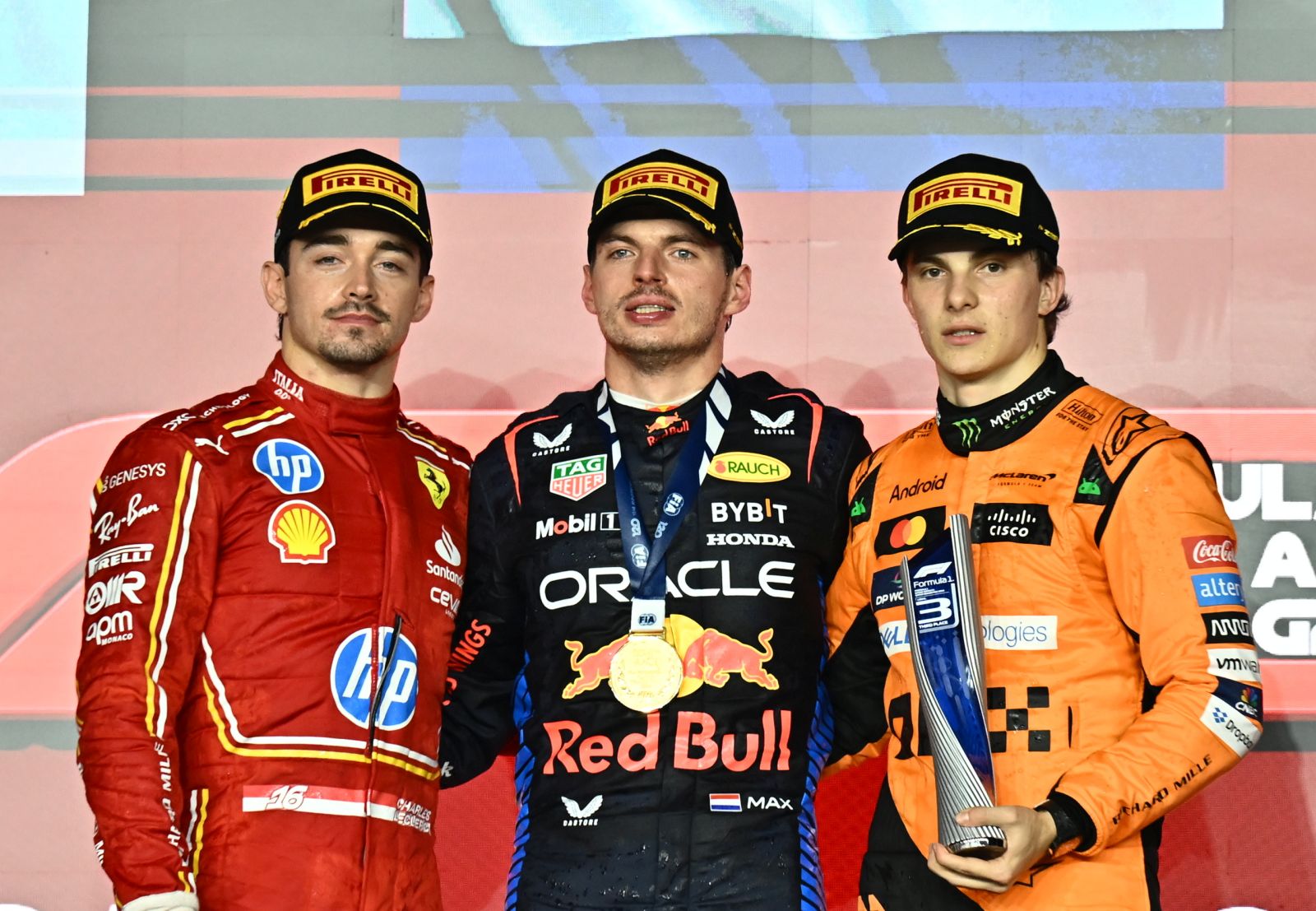 epa11752176 (L-R) Second-placed Scuderia Ferrari driver Charles Leclerc of Monaco, first-placed Red Bull Racing driver Max Verstappen of Netherlands, and third-placed McLaren driver Oscar Piastri of Australia pose on the podium after the Formula 1 Qatar Grand Prix at the Lusail International Circuit racetrack in Lusail, Qatar, 01 December 2024.  EPA/NOUSHAD THEKKAYIL