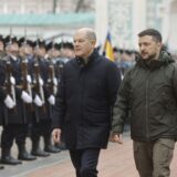 epa11753336 Ukrainian President Volodymyr Zelensky (R) and German Chancellor Olaf Scholz (L) review the Guard of Honor at the St. Sophia Cathedral of the National Reserve 'Sophia of Kyiv' in Kyiv, Ukraine, 02 December 2024. Olaf Scholz arrived in Kyiv to meet with top Ukrainian officials amid the ongoing Russian invasion.  EPA/SERGEY DOLZHENKO 70477