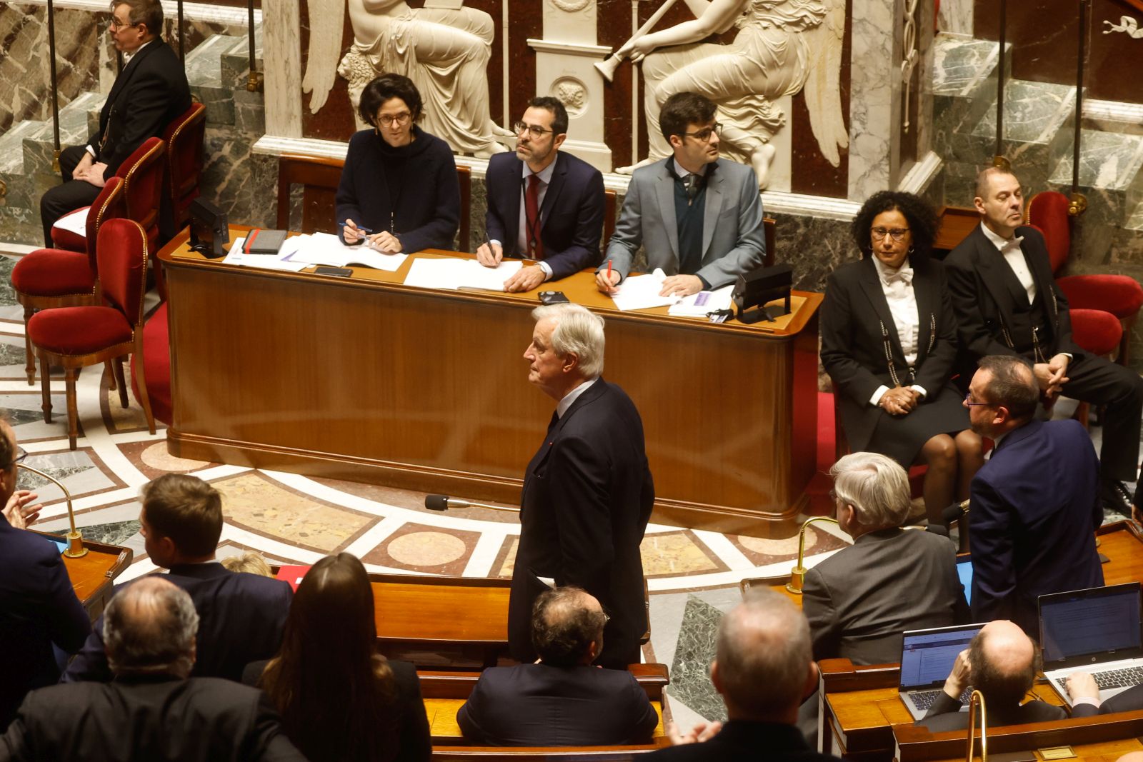 epa11753368 French Prime Minister Michel Barnier (C) attends the French National Assembly debate on parts of France's 2025 budget bill, in Paris, France, 02 December 2024. Prime Minister Barnier activated Article 49.3 of the Constitution to pass his social security budget bill without a vote, as a majority of members of Parliament rejected his project on 02 December 2024.  EPA/MOHAMMED BADRA