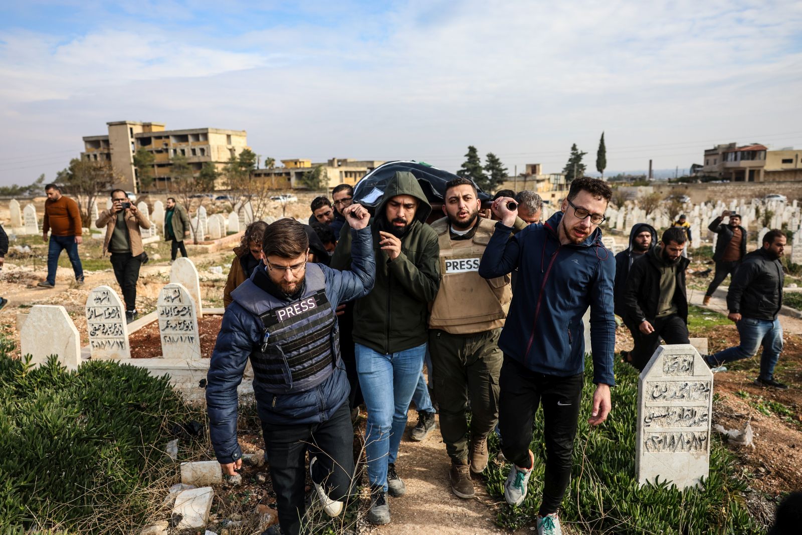 epaselect epa11756388 People carry the body of Syrian photojournalist Anas al-Kharboutli, who was killed in an airstrike, during his funeral procession in Idlib, Syria, 04 December 2024. Al-Kharboutli was killed on 04 December in an airstrike on Murk city, Hama countryside, while covering the ongoing fighting between opposition and government forces, according to the Syrian Observatory for Human Rights (SOHR). The Syrian Journalists Association warned on 01 December that journalists covering the recent military developments in Syria are facing dangers and direct targeting threatening their lives. Syrian opposition forces, led by the Islamist militant group Hayat Tahrir al-Sham (HTS), launched an offensive on 27 November, taking large parts of Aleppo, Syria's second-largest city. The offensive triggered counterattacks by the Syrian regime forces as well as Russian and Syrian airstrikes on opposition-controlled areas. SOHR stated that the fighting left more than 600 people dead as of 03 December.  EPA/MOHAMMED AL RIFAI