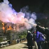 epa11761055 A supporter of the Georgian opposition launches fireworks during a protest in front of the Parliament building in Tbilisi, Georgia, 06 December 2024. Thousands of pro-EU activists continue their protests in the Georgian capital against the country's ruling party decision to suspend accession talks with the European Union (EU) until the end of 2028.  EPA/DAVID MDZINARISHVILI