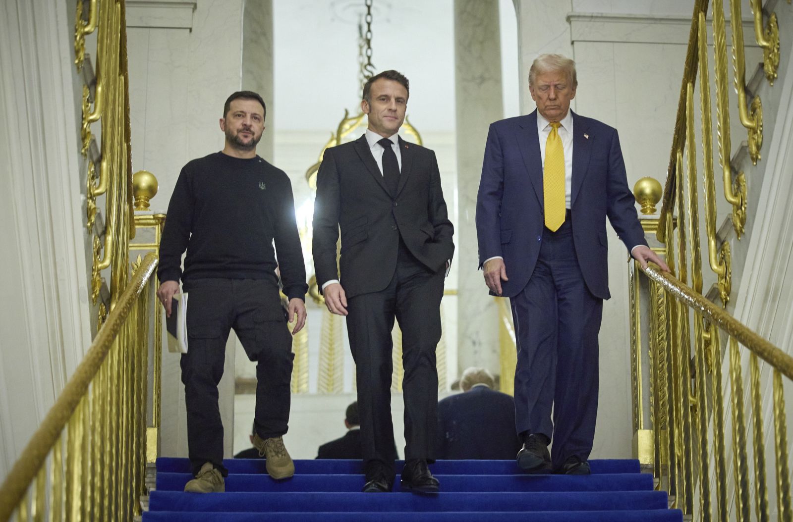 epa11763051 A handout picture made available by the Presidential Press Service of Ukraine shows (L-R) Ukrainian President Volodymyr Zelensky, French President Emmanuel Macron, and US President-elect Donald Trump during their meeting at the Elysee Palace, as part of ceremonies marking the reopening of the Notre Dame de Paris Cathedral, in Paris, France, 07 December 2024. The Notre Dame de Paris Cathedral reopens on 07 December after nearly six years of renovation work following its destruction by a fire on 15 April 2019.  EPA/Presidential Press Service of Ukraine HANDOUT  HANDOUT EDITORIAL USE ONLY/NO SALES