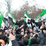 epa11764571 Supporters of the Syrian opposition residing in Germany celebrate the rebel take over of Damascus, in Berlin, Germany, 08 December 2024. Syrian rebels entered Damascus on 08 December 2024 and announced in a televised statement the 'Liberation of the city of Damascus and the overthrow of Bashar al-Assad,' as well as the release of all the prisoners. The rebels also urged the Syrian armed forces to leave Syrian public institutions, which will stay under the control of the outgoing Syrian prime minister until the official handover ceremony.  EPA/CLEMENS BILAN