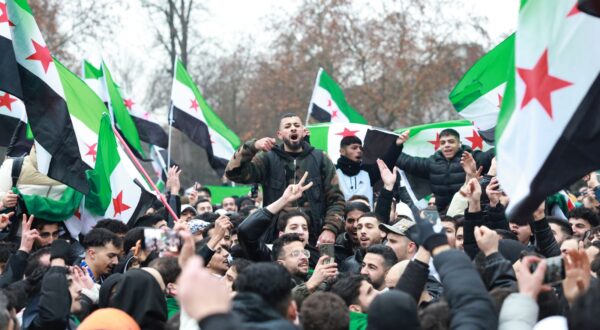 epa11764571 Supporters of the Syrian opposition residing in Germany celebrate the rebel take over of Damascus, in Berlin, Germany, 08 December 2024. Syrian rebels entered Damascus on 08 December 2024 and announced in a televised statement the 'Liberation of the city of Damascus and the overthrow of Bashar al-Assad,' as well as the release of all the prisoners. The rebels also urged the Syrian armed forces to leave Syrian public institutions, which will stay under the control of the outgoing Syrian prime minister until the official handover ceremony.  EPA/CLEMENS BILAN