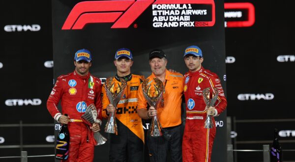 epa11764930 (L-R) Second placed Scuderia Ferrari driver Carlos Sainz Jr. of Spain, first placed McLaren driver Lando Norris of Britain, McLaren Racing CEO Zak Brown and third placed Scuderia Ferrari driver Charles Leclerc of Monaco celebrate on the podium after the Formula One Abu Dhabi Grand Prix, at the Yas Marina Circuit racetrack in Abu Dhabi, United Arab Emirates, 08 December 2024.  EPA/ALI HAIDER