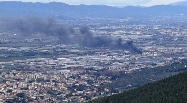 epa11766728 Smoke rises at the 'Eni' fuel depot following an explosion, in Calenzano, Florence, Italy, 09 December 2024. At least two people were killed, while nine others were injured and three were still missing, according to Tuscany's governor. A fire broke out at the fuel storage, affecting just the loading area and not the tanks, according to a statement issued by Eni.  EPA/CLAUDIO GIOVANNINI