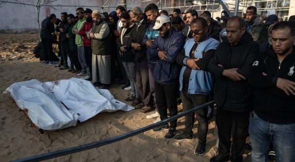 epa11771770 Palestinians pray in front of the bodies of their relatives who were killed in an Israeli airstrike, west of Khan Younis in the southern Gaza Strip, 12 December 2024. According to Nasser Hospital in Gaza, more than 12 Palestinians guarding humanitarian aid were killed in an Israeli airstrike west of Khan Younis. More than 45,000 Palestinians and over 1,400 Israelis have been killed, according to the Palestinian Health Ministry and the Israeli Army, since Hamas militants launched an attack against Israel from the Gaza Strip on 07 October 2023, and the Israeli operations in Gaza and the West Bank which followed it.  EPA/HAITHAM IMAD