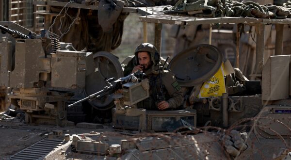 epa11774260 An Israeli soldier aboard an armoured vehicle mans a machine gun as they cross into the buffer zone between Israel and Syria, near the Druze village of Majdal Shams, in the Israeli-annexed Golan Heights, 13 December 2024. Israel's military said that paratroopers' forces, joined by other troops, are conducting 'defense activities' to prevent 'any threat' and are deployed in key positions within the buffer zone.  EPA/ATEF SAFADI