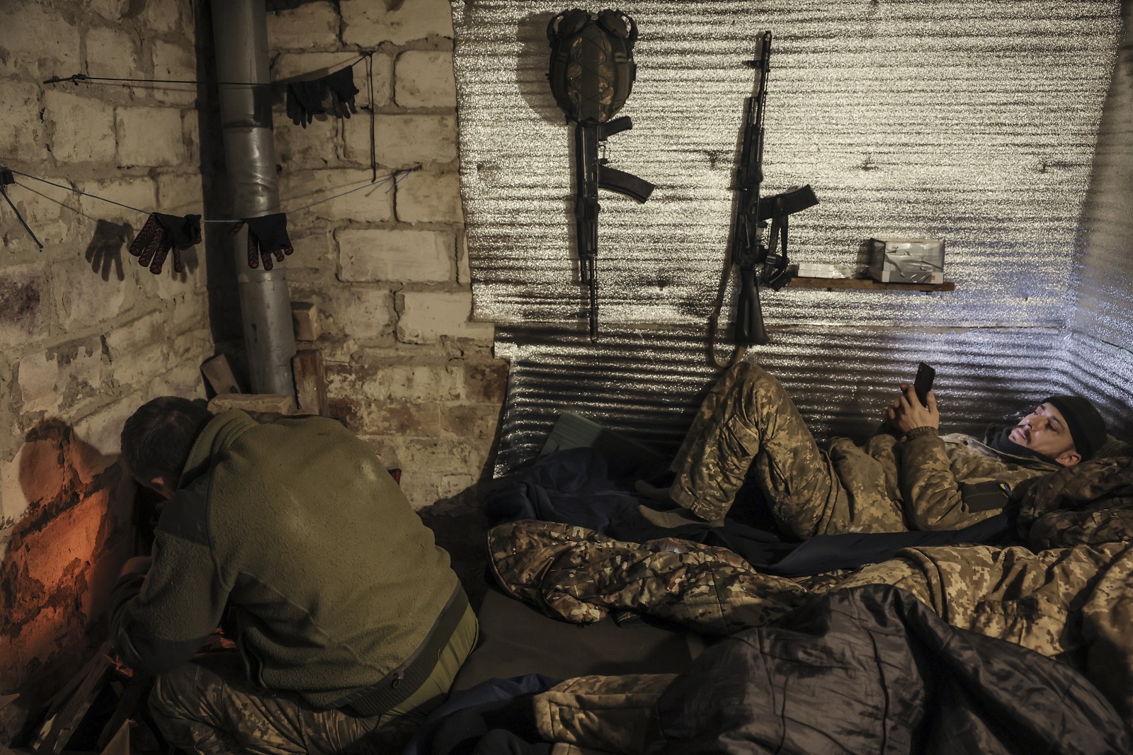 epa11774868 A handout photo made available by the press service of the 24th Mechanized Brigade of the Ukrainian Armed Forces shows servicemen of the artillery unit of 24th Mechanized Brigade resting in a shelter close to their position near Chasiv Yar, Donetsk region, Ukraine, 12 December 2024, (issued 13 December 2024).  EPA/24th Mechanized Brigade HANDOUT  HANDOUT EDITORIAL USE ONLY/NO SALES