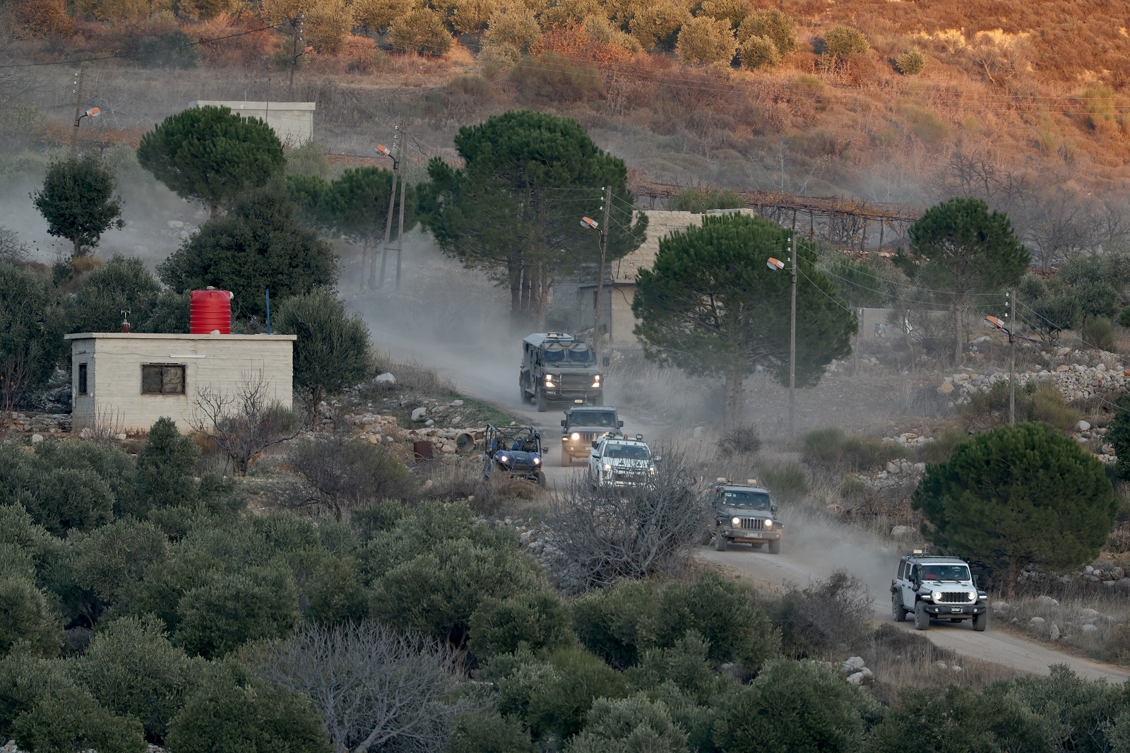 epa11776772 Israeli troops on the Syrian side of the border, between Israel and Syria, near the Druze village of Majdal Shams, in the Israeli-annexed Golan Heights, 14 December 2024. Israel's military said that paratroopers' forces, joined by other troops, are conducting 'defense activities' to prevent 'any threat' and are deployed in key positions within the buffer zone.  EPA/ATEF SAFADI