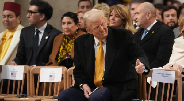 epa11763097 US President-elect Donald Trump (C) gestures as he sits inside the Notre Dame de Paris cathedral during its official reopening ceremony, in Paris, France, 07 December 2024. The Notre Dame de Paris Cathedral reopens on 07 December after nearly six years of renovation work following its destruction by a fire on 15 April 2019.  EPA/THIBAULT CAMUS / POOL  MAXPPP OUT