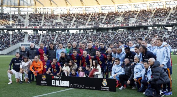 epa11778071 FC Barcelona Legends' Andres Iniesta (C) poses with his family and players after a friendly soccer match between FC Barcelona Legends and Real Madrid Legends at Ajinomoto Stadium, in Tokyo, Japan, 15 December 2024.  EPA/FRANCK ROBICHON