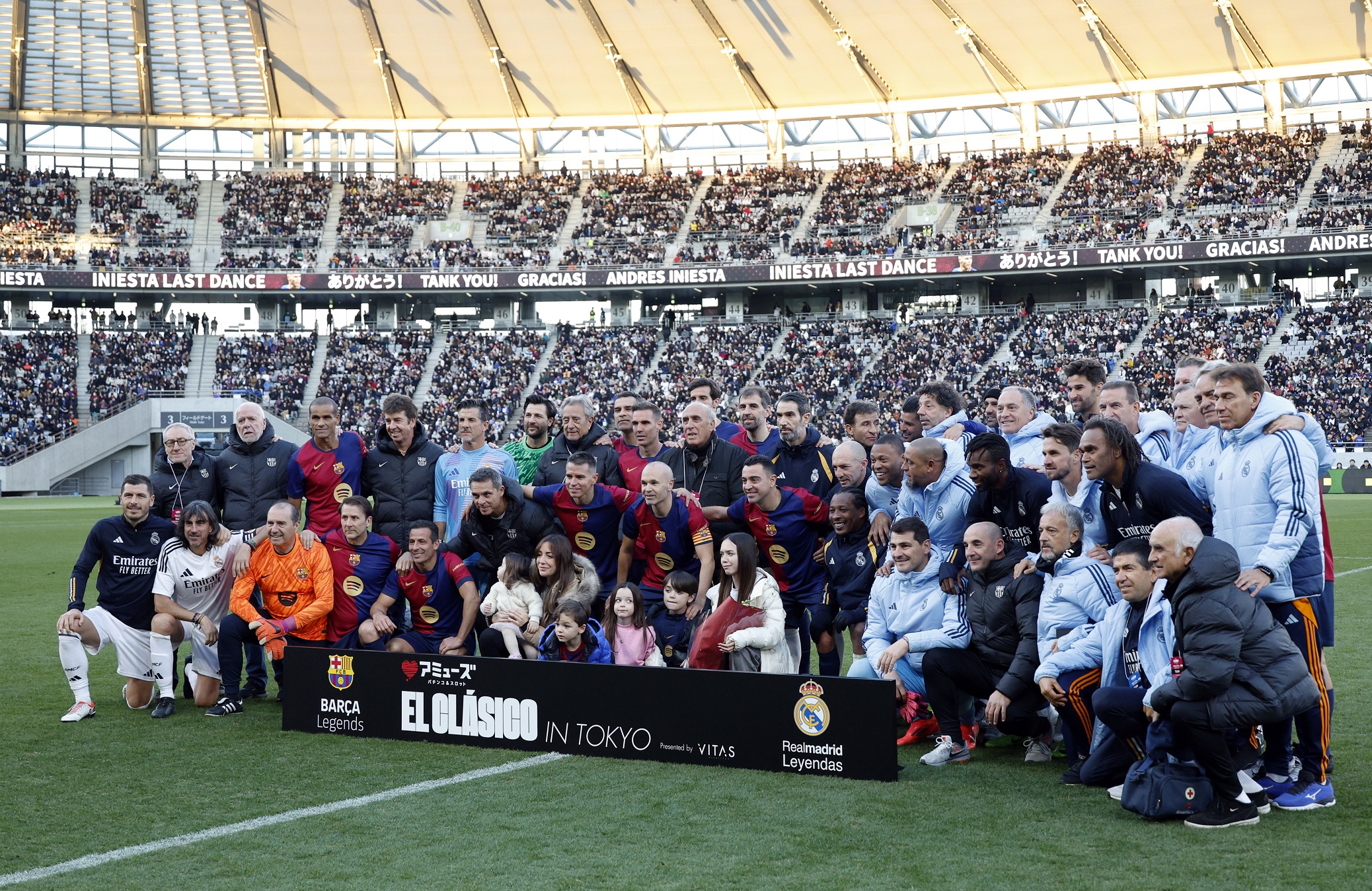 epa11778071 FC Barcelona Legends' Andres Iniesta (C) poses with his family and players after a friendly soccer match between FC Barcelona Legends and Real Madrid Legends at Ajinomoto Stadium, in Tokyo, Japan, 15 December 2024.  EPA/FRANCK ROBICHON