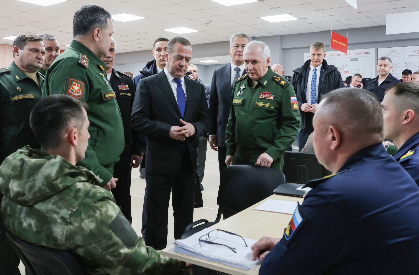 epa11791923 Russian Security Council, United Russia Party Chairman Dmitry Medvedev (C) visits the Unified Center for Selecting Citizens for Military Service under the 'Defender' Contract in Ufa, Russia, 24 December 2024.  EPA/EKATERINA SHTUKINA / SPUTNIK / GOVERNMENT / POOL