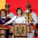 epa11792018 Moldovan President Maia Sandu takes the oath on the Moldova's Constitution during her inauguration ceremony at the Republican Palace in Chisinau, Moldova, 24 December 2024. Sandu took the oath of office for a second term after winning the runoff of the presidential elections held in Moldova on 03 November.  EPA/DUMITRU DORU