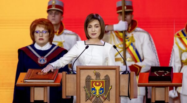 epa11792018 Moldovan President Maia Sandu takes the oath on the Moldova's Constitution during her inauguration ceremony at the Republican Palace in Chisinau, Moldova, 24 December 2024. Sandu took the oath of office for a second term after winning the runoff of the presidential elections held in Moldova on 03 November.  EPA/DUMITRU DORU