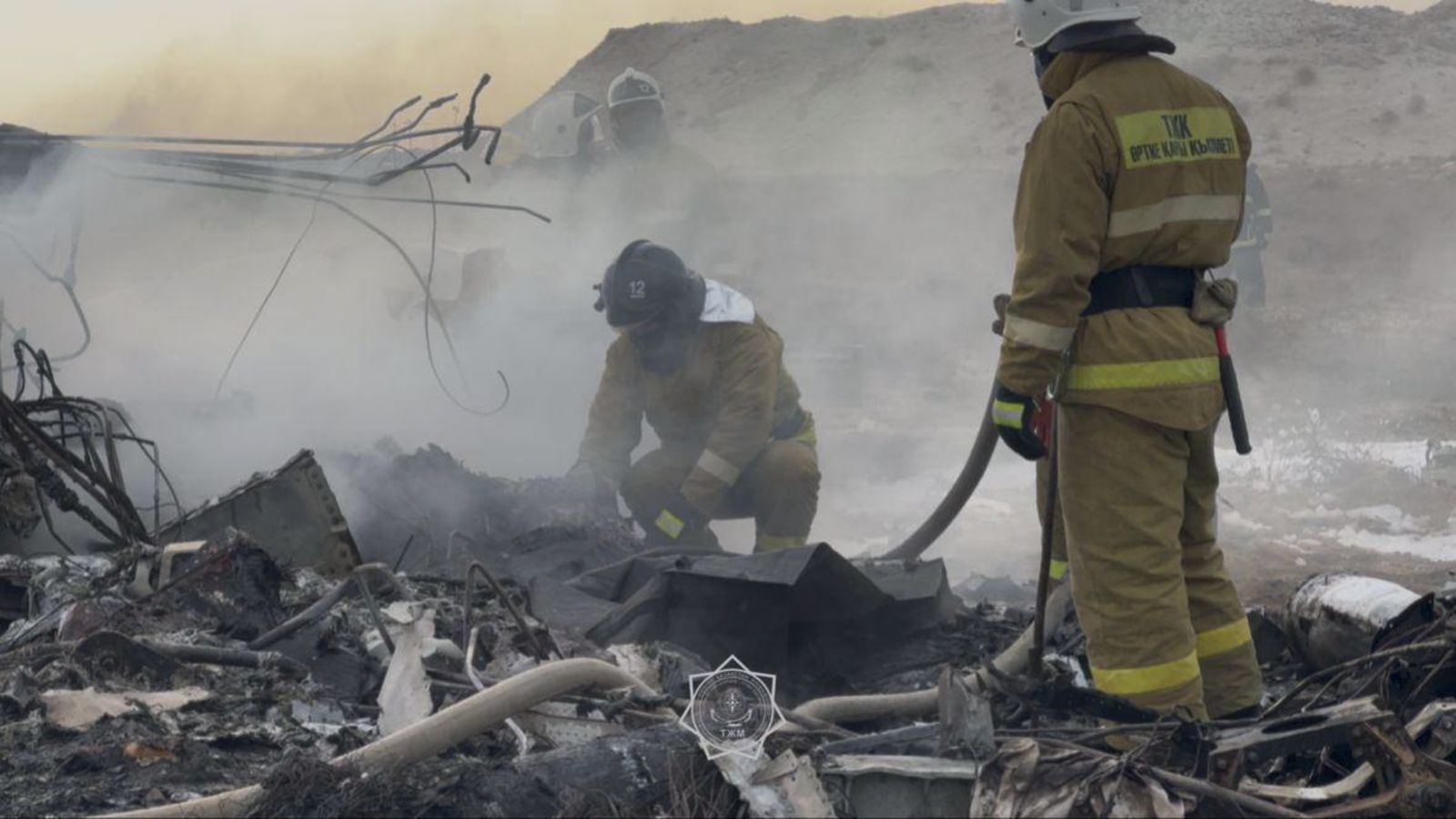 epa11792900 A handout photo made available by the press service of the Ministry for Emergency Situations of Kazakhstan shows emergency specialists working at the crash site of a passenger plane near Aktau, Kazakhstan, 25 December 2024. Azerbaijan Airlines Embraer ERJ-190AR passenger plane flying from Baku to Grozny crashed some three kilometres away from the city of Aktau. According to preliminary information, the incident was caused by a collision between the aircraft and a flock of birds.  EPA/KAZAKHSTAN EMERGENCIES MINISTRY HANDOUT -- BEST QUALITY AVAILABLE -- MANDATORY CREDIT -- HANDOUT EDITORIAL USE ONLY/NO SALES