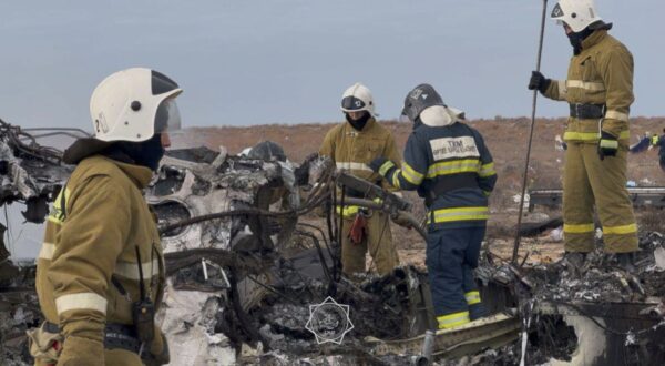 epa11792898 A handout photo made available by the press service of the Ministry for Emergency Situations of Kazakhstan shows emergency specialists working at the crash site of a passenger plane near Aktau, Kazakhstan, 25 December 2024. Azerbaijan Airlines Embraer ERJ-190AR passenger plane flying from Baku to Grozny crashed some three kilometres away from the city of Aktau. According to preliminary information, the incident was caused by a collision between the aircraft and a flock of birds.  EPA/KAZAKHSTAN EMERGENCIES MINISTRY HANDOUT -- BEST QUALITY AVAILABLE -- MANDATORY CREDIT -- HANDOUT EDITORIAL USE ONLY/NO SALES