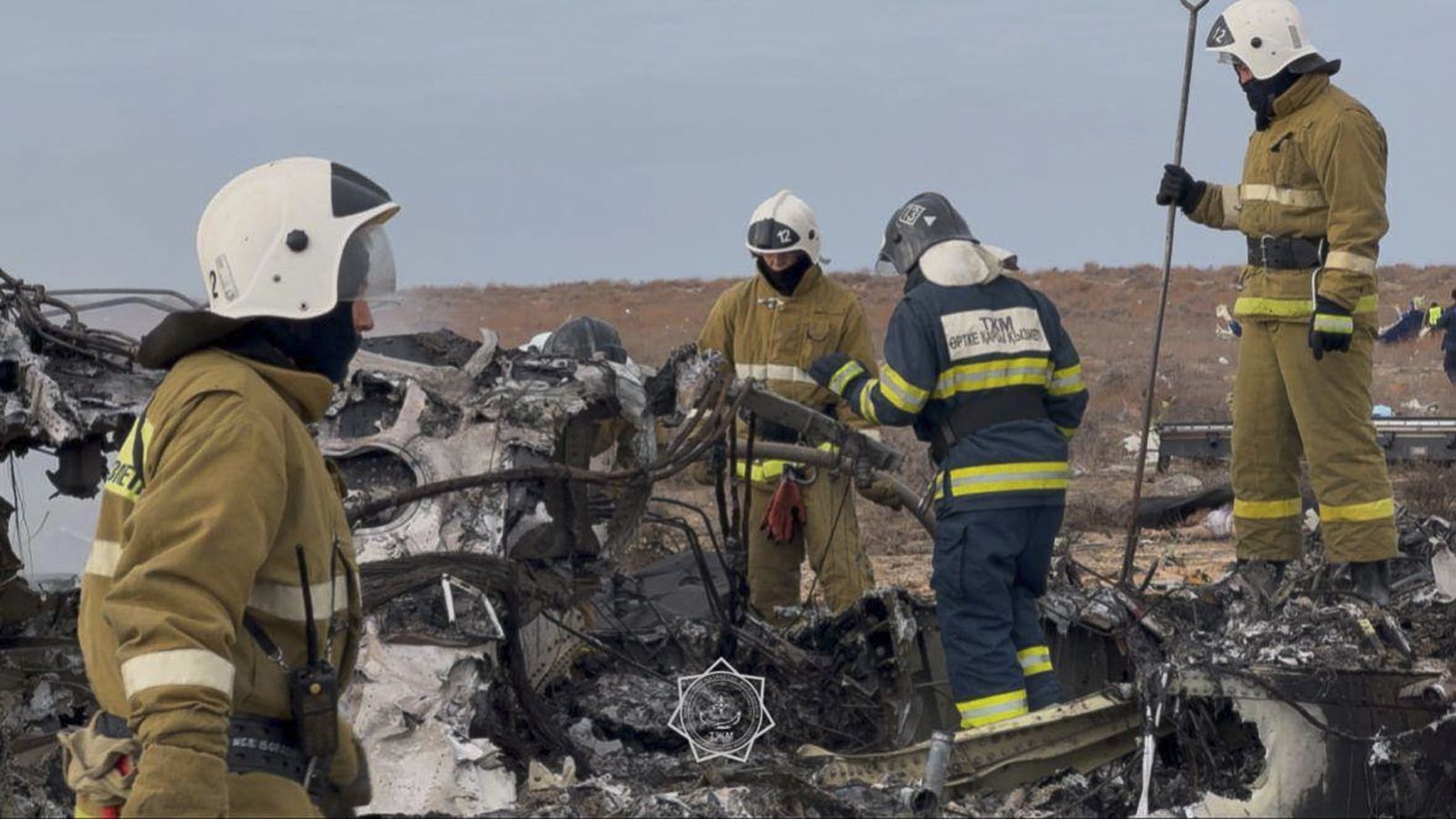 epa11792898 A handout photo made available by the press service of the Ministry for Emergency Situations of Kazakhstan shows emergency specialists working at the crash site of a passenger plane near Aktau, Kazakhstan, 25 December 2024. Azerbaijan Airlines Embraer ERJ-190AR passenger plane flying from Baku to Grozny crashed some three kilometres away from the city of Aktau. According to preliminary information, the incident was caused by a collision between the aircraft and a flock of birds.  EPA/KAZAKHSTAN EMERGENCIES MINISTRY HANDOUT -- BEST QUALITY AVAILABLE -- MANDATORY CREDIT -- HANDOUT EDITORIAL USE ONLY/NO SALES