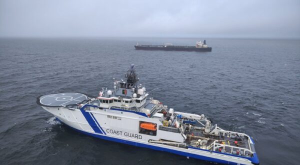 epa11795031 A handout photo dated made available by the Finnish Border Guard on 27 December 2024 shows a border guard vessel and tanker Eagle S off Porkkalanniemi peninsula, Finland, 27 December 2024. Finnish authorities are investigating the Eagle S, an oil tanker registered with the Cook Islands, suspected of having caused the outage of an undersea power cable connecting Finland and Estonia on 25 December.  EPA/HANDOUT HANDOUT EDITORIAL USE ONLY/NO SALES