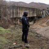 A Kosovo police officer patrols near the damaged canal supplying water to two coal-fired power plants that generate nearly all of the country's electricity, in Varage, near Zubin Potok, Kosovo December 1, 2024. REUTERS/Valdrin Xhemaj Photo: Valdrin Xhemaj/REUTERS