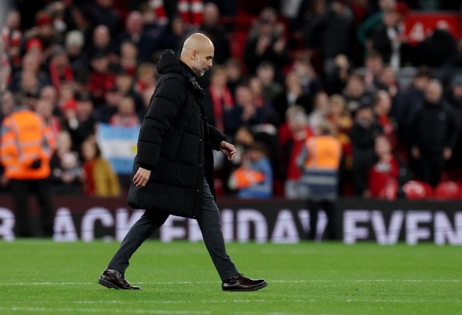 Soccer Football - Premier League - Liverpool v Manchester City - Anfield, Liverpool, Britain - December 1, 2024  Manchester City manager Pep Guardiola looks dejected after the match REUTERS/Phil Noble EDITORIAL USE ONLY. NO USE WITH UNAUTHORIZED AUDIO, VIDEO, DATA, FIXTURE LISTS, CLUB/LEAGUE LOGOS OR 'LIVE' SERVICES. ONLINE IN-MATCH USE LIMITED TO 120 IMAGES, NO VIDEO EMULATION. NO USE IN BETTING, GAMES OR SINGLE CLUB/LEAGUE/PLAYER PUBLICATIONS. PLEASE CONTACT YOUR ACCOUNT REPRESENTATIVE FOR FURTHER DETAILS.. Photo: Phil Noble/REUTERS