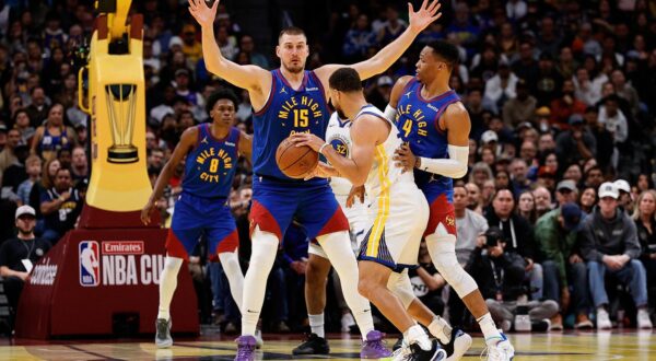 Dec 3, 2024; Denver, Colorado, USA; Golden State Warriors guard Stephen Curry (30) controls the ball under pressure from Denver Nuggets guard Russell Westbrook (4) and center Nikola Jokic (15) in the fourth quarter at Ball Arena. Mandatory Credit: Isaiah J. Downing-Imagn Images Photo: Isaiah J. Downing/REUTERS