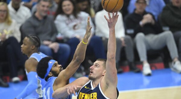 Dec 5, 2024; Cleveland, Ohio, USA; Denver Nuggets center Nikola Jokic (15) shoots beside Cleveland Cavaliers center Jarrett Allen (31) in the first quarter at Rocket Mortgage FieldHouse. Mandatory Credit: David Richard-Imagn Images Photo: David Richard/REUTERS