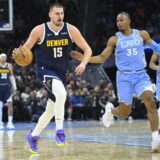 Dec 5, 2024; Cleveland, Ohio, USA; Denver Nuggets center Nikola Jokic (15) brings the ball up court beside Cleveland Cavaliers forward Isaac Okoro (35) in the second quarter at Rocket Mortgage FieldHouse. Mandatory Credit: David Richard-Imagn Images Photo: David Richard/REUTERS