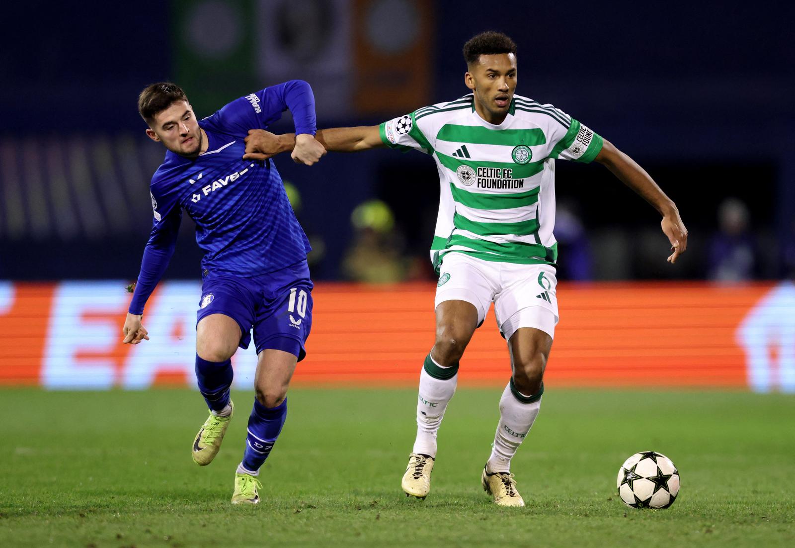 Soccer Football - Champions League - GNK Dinamo Zagreb v Celtic - Stadion Maksimir, Zagreb, Croatia - December 10, 2024 GNK Dinamo Zagreb's Martin Baturina in action with Celtic's Auston Trusty REUTERS/Antonio Bronic Photo: Antonio Bronic/REUTERS